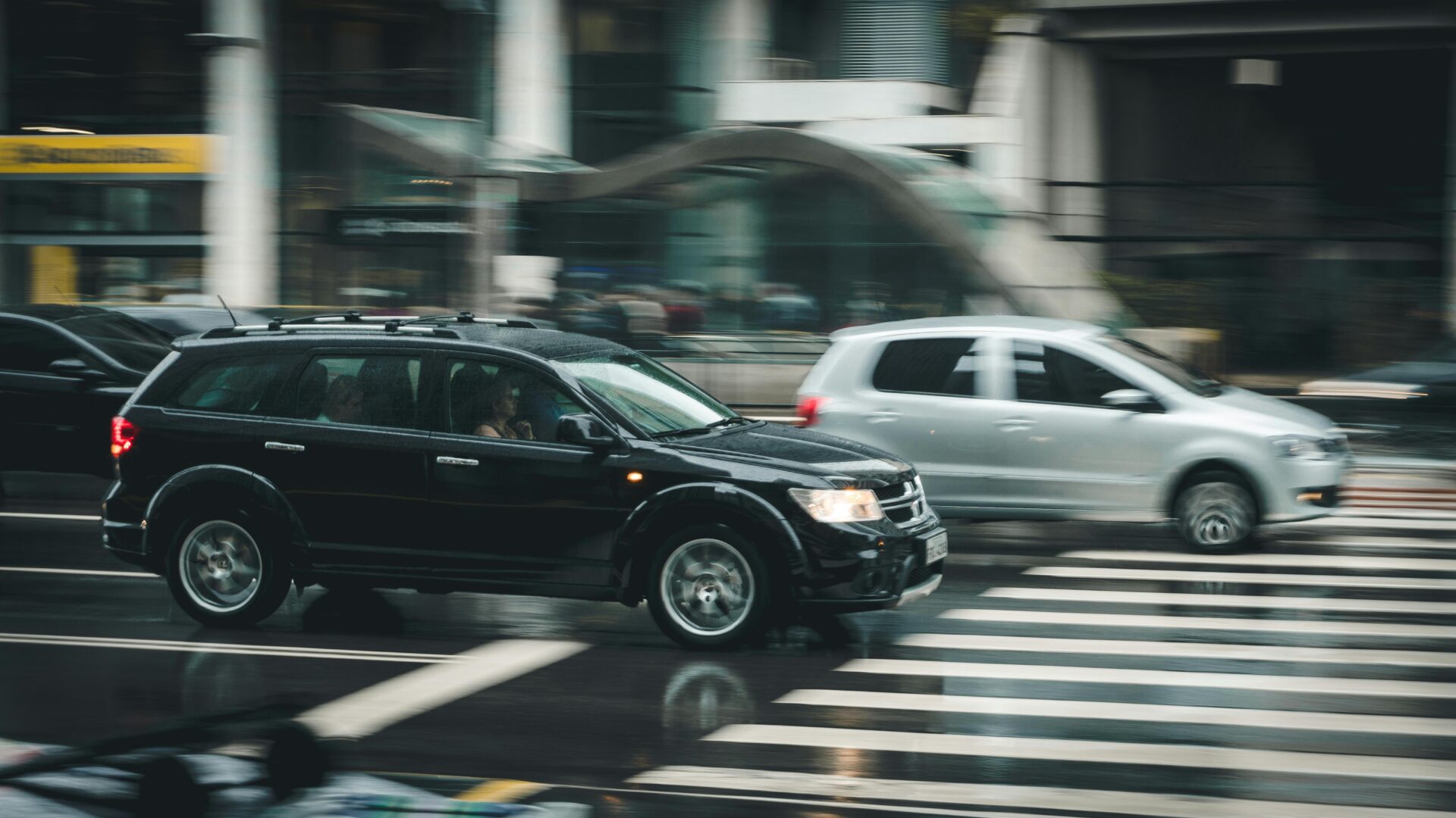black car behind the pedestrian lane