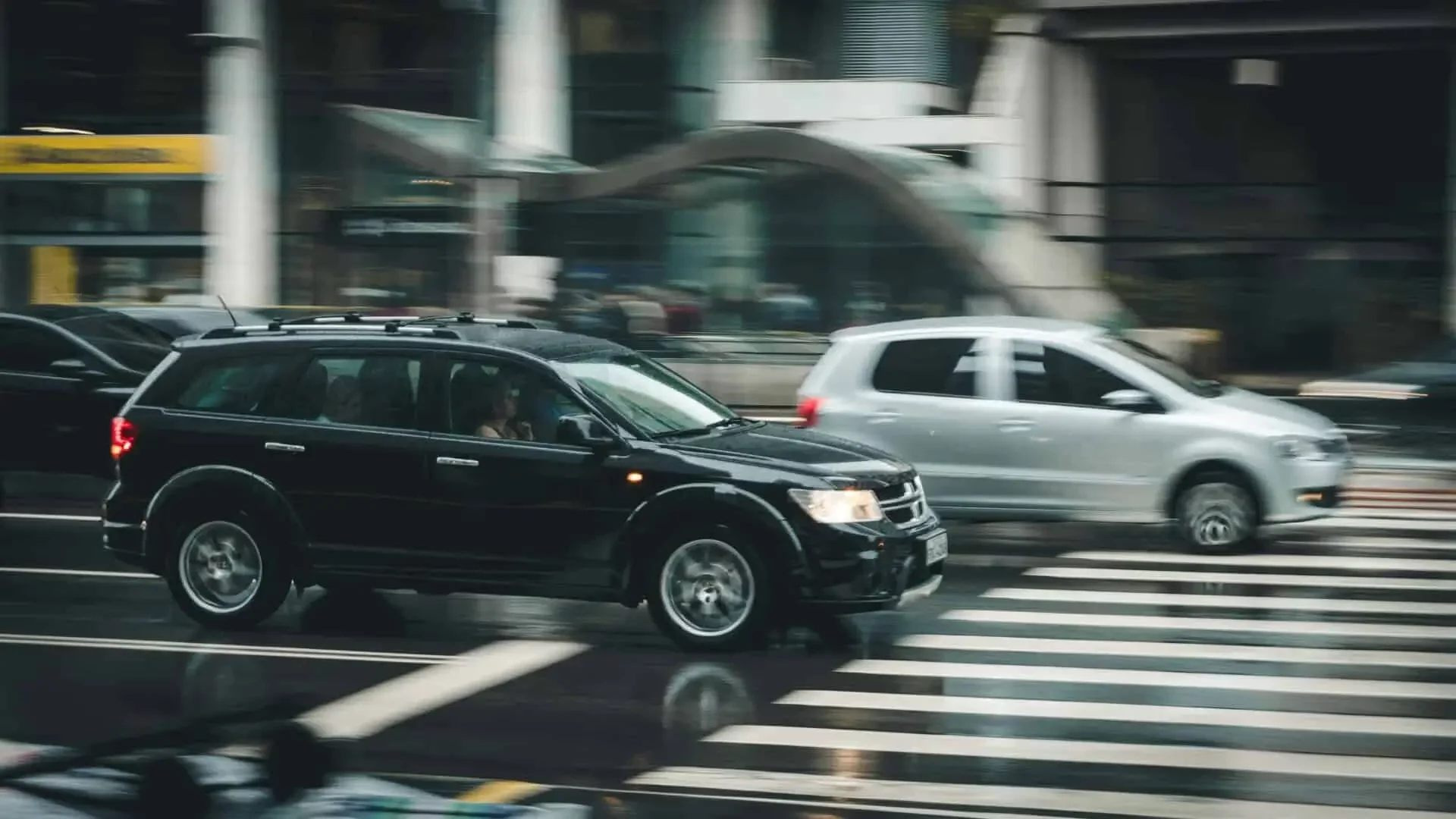 black car behind the pedestrian lane