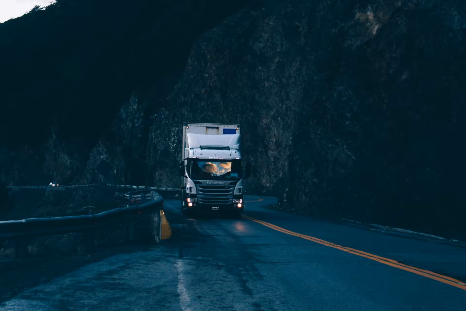 A heavy-duty commercial truck in the middle of the road